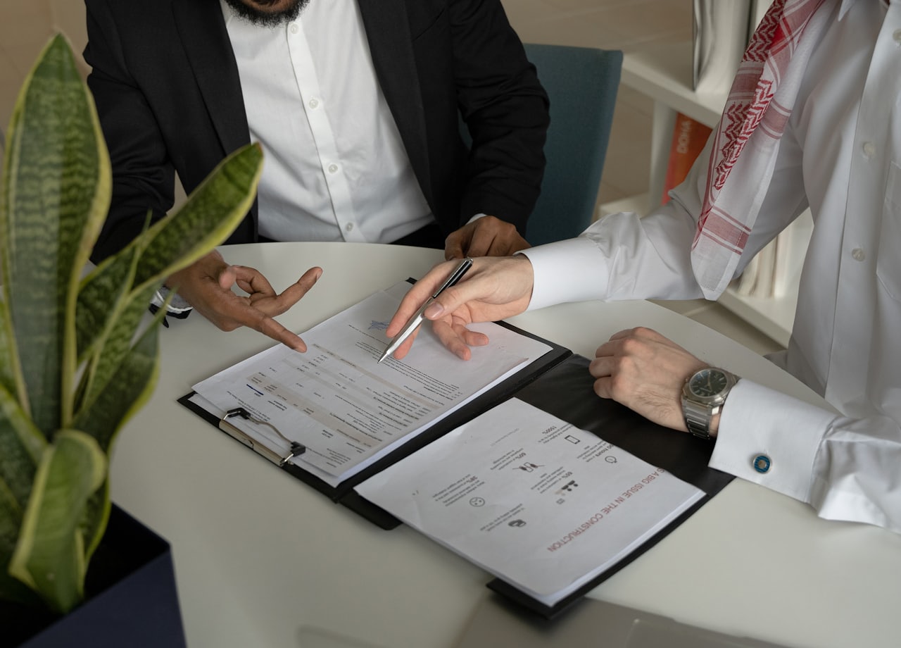 A dentist and PPC advisor reviewing a practice transition agreement